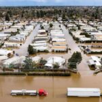 Another storm floods California houses, displacing over 25,000; 19 dead.