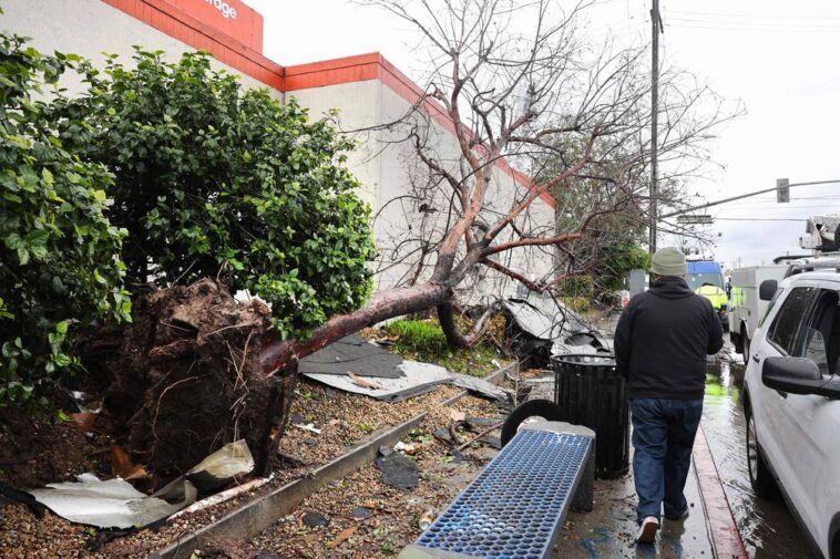 In the U.S. state of California, a tornado rips off roofs and throws cars around