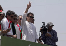 Supporters of Imran Khan flung rose petals at the convoy transporting