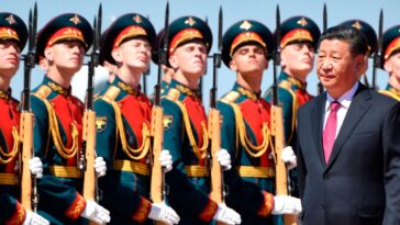 The Chinese leader Xi Jinping arrives in Moscow for a summit with Vladimir Putin