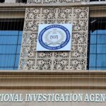 NIA officer suspended on corruption charges