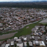 At least 27 dead, 1,600 homeless in Brazil storm as family seek aid.